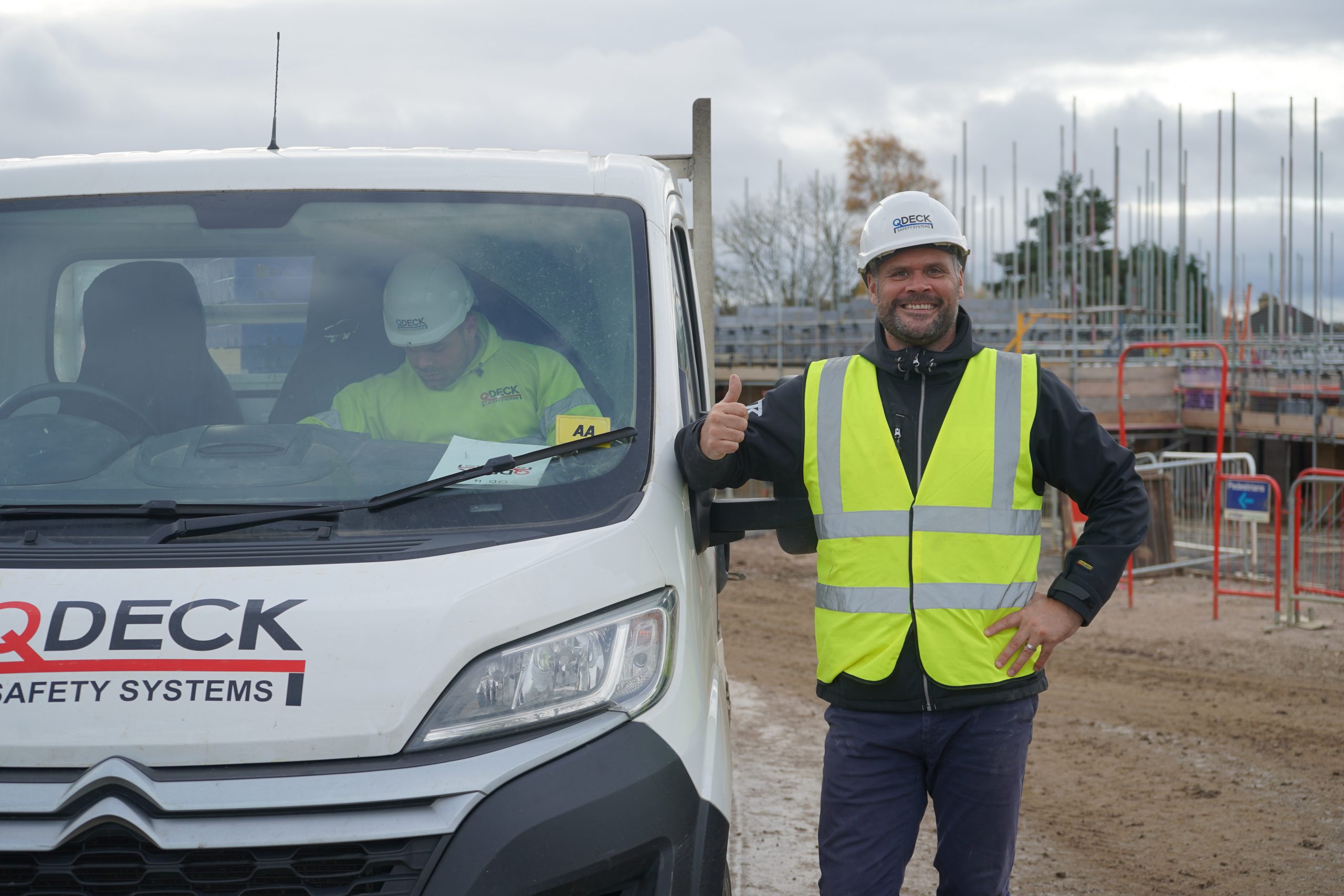 QDeck van and team on a construction site